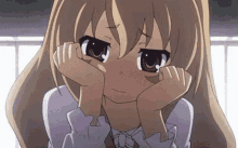 a close up of a sad anime girl with her head in her hands .