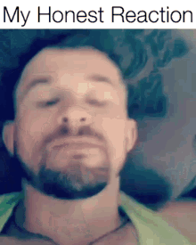 a close up of a man 's face with the words " my honest reaction " below it