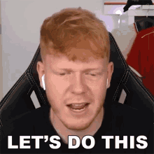 a man with red hair and a beard is wearing ear buds and says let 's do this