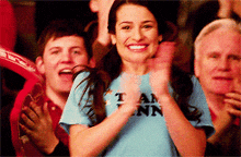 a woman wearing a blue shirt that says team ann