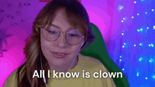 a girl wearing glasses and headphones says all i know is clown