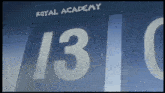 a sign for the royal academy has the number 13 painted on it