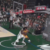 a basketball game is being played on a court with a sign that says state farm on it .