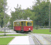 a red and yellow train with the number 1 on the top of it