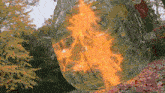 a painting of a skull with a fire coming out of it