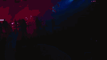 a dark blue background with a few lights shining