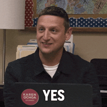 a man with a karen ochoa sticker on his laptop says yes