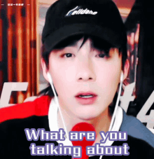a man wearing a celldane hat and ear buds is talking about something
