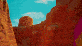 a computer generated image of a canyon with a blue sky