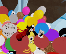 a bunch of colorful balloons including one with a face on it