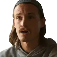 a man with long hair and a mustache wearing a baseball cap