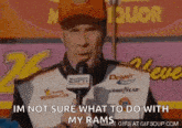 a race car driver is talking into a microphone and says i 'm not sure what to do with my rams .