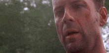 a close up of a man 's face with a few spots on it