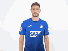 a man in a blue shirt that says sap on it