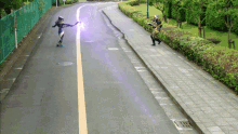 a person standing on the side of a road with a purple light coming from their hand