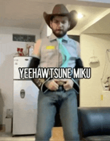 a man wearing a cowboy hat and tie is standing in a living room with the words yeehawtsune miku written above him