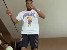 a man wearing a t-shirt with the word wutang on the front
