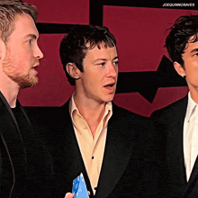 three men in suits are standing next to each other with the caption joequinncraves above them