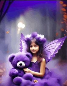 a little girl with purple fairy wings holds a purple teddy bear