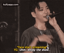 a man is screaming into a microphone and says fans start screaming