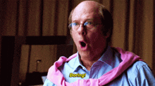 a bald man wearing glasses and a pink sweater says boring !