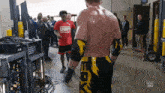 a wrestler in a red shirt that says sfwf