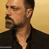 a man with a beard has the name kevserpayasi on the bottom of the picture