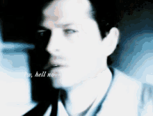 a blurry photo of a man with the words " aw hell no " written on the bottom