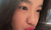 a close up of a woman making a funny face