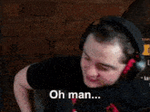 a man wearing headphones is making a funny face and saying dude , the ball comedy .