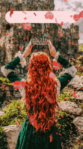a woman with red hair is holding a crown in front of a castle