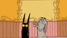 a black cat and a gray rabbit are standing next to each other .