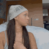 a woman wearing a white hat that says au on it
