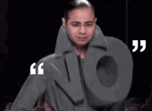 a man is wearing a jacket that looks like the letter n.