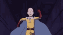 a bald man in a yellow suit and red gloves is running through a tunnel .