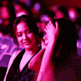 two women are sitting in a dark room and the word filmance is on the bottom left