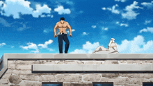 a man is standing on the roof of a building with a blue sky in the background