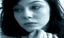 a woman with a serious look on her face