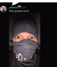 a picture of a person with a bandana on their face with a tweet from yebrina