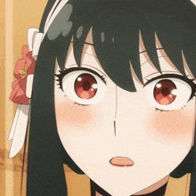 a close up of a girl 's face with a bow in her hair