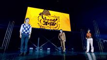 a crowd of people watching a concert with the abema logo in the corner