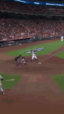 a baseball player with the number 7 on his jersey throws a ball