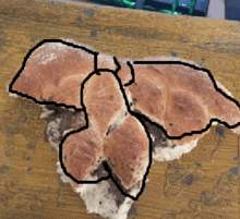 a drawing of a mushroom on a wooden table