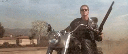 Arnold Schwarzenegge Motorcycle GIF - Arnold Schwarzenegge Motorcycle Gun -  Discover & Share GIFs