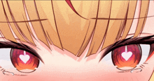 a close up of a person 's eyes with a heart in them