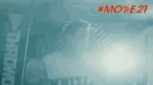a close up of a man 's face with the words mode 21 written in red .