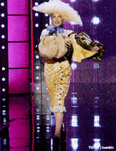 a woman in a costume is dancing on a stage with tumblr written on the bottom of the image