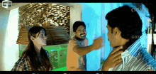 a man and a woman are standing next to each other and the word geeta is on the bottom of the screen