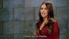 a woman says " thanks but no thanks " in a red jacket