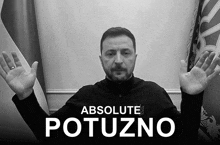 a black and white photo of a man with absolute potuzno written in white letters